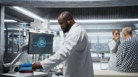 Black medic using artificial intelligence to observe effect during new drug test Stock Photos