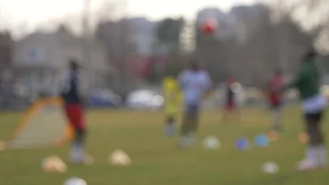 Black men coaching soccer header on grass lawn field Stock Footage 277014748