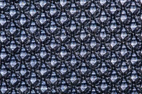 Black mesh fabric texture macro sports clothing background close up Stock Photos