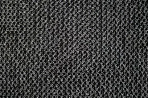 Black mesh textile surface with diamond openings breathable durable fabric Stock Photos