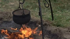 Traditional Cuisine Big Black Pot Cooking Food, Natural Fire With Wood  Heating Stock Photo, Picture and Royalty Free Image. Image 91055974.