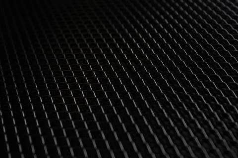 Black metal mesh under dim light source Stock Photos