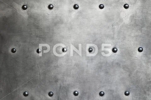 Black metal plate or armour texture with rivets Stock Photos