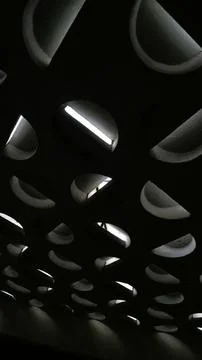 Black metal surface with a repeating pattern of rounded triangular shape Stock Photos