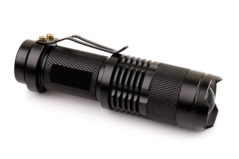 Black metallic flashlight isolate on white background. Foto stock