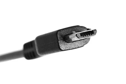 Black micro usb cable isolated on white background. Closeup Stock Photos