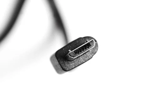 Black micro usb cable isolated on white background. Closeup Stock Photos