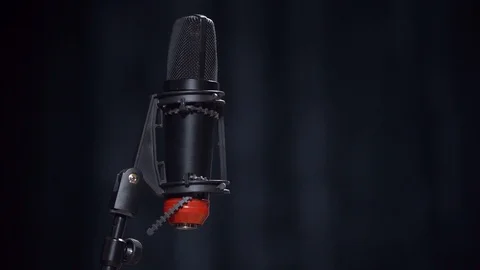 Black microphone on a black background,  스톡 동영상 107193308