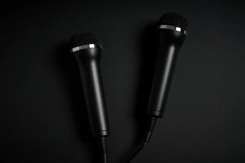 Black microphone on black background Foto stock