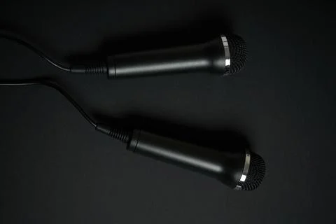 Black microphone on black background Stock Photos