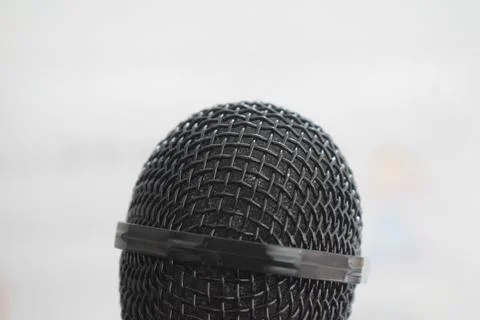 Black microphone close-up with white background Stock Photos