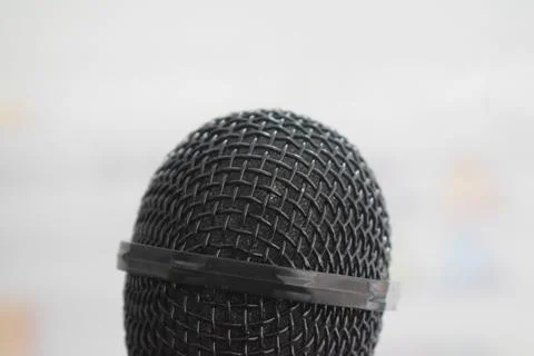 Black microphone close-up with white background Stock Photos