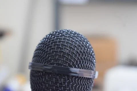 Black microphone close-up with white background Stock Photos