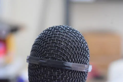 Black microphone close-up with white background Stock Photos