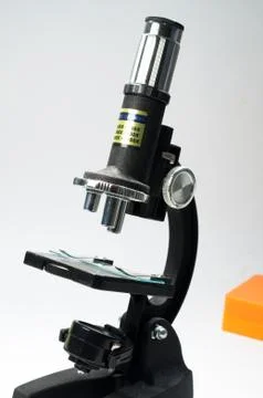 Black microscope on a white background. Stock Photos