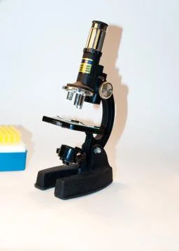 Black microscope on a white background. Stock Photos