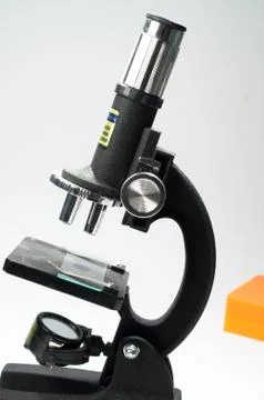 Black microscope on a white background. Stock Photos