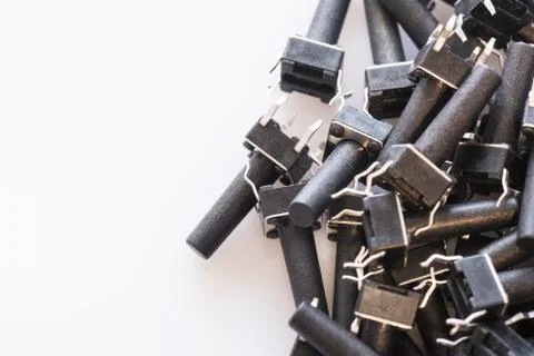 Black microswitch buttons on white background with copyspace. Electronic comp Stock Photos