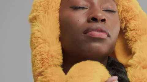 Black mixed race model in studio wear yellow outwear bright outumn look Stock Footage 101196919