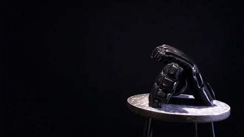 Black MMA fighting gloves rotating on round stool. Video stock 73761431