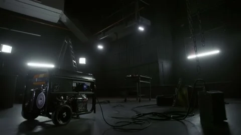Black mobile gasoline power generator in a dark workshop. Gasoline powered Stock Footage 233835030