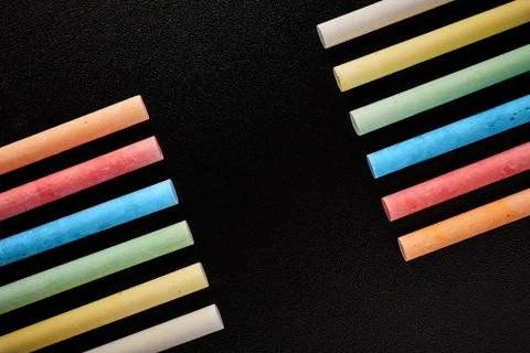Black mockup with colored crayons. Back to school Stock Photos
