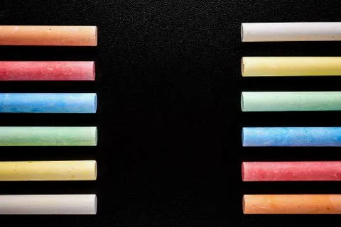 Black mockup with colored crayons. Back to school Stock Photos