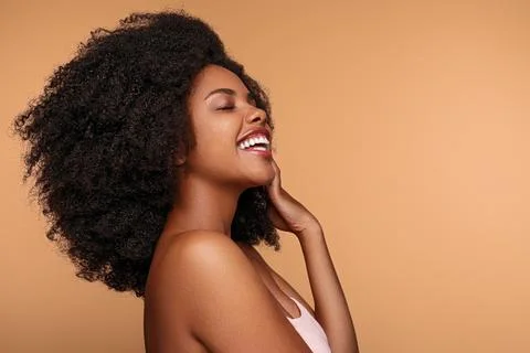 Black model touching face and laughing Stock Photos
