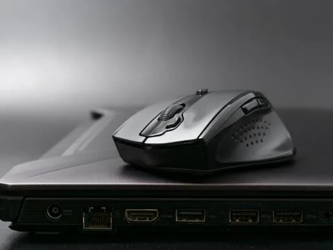 Black modern computer mouse on dark background Stock-Fotos
