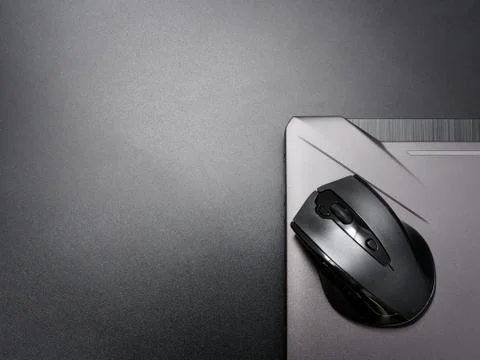 Black modern computer mouse on dark background Stock-Fotos