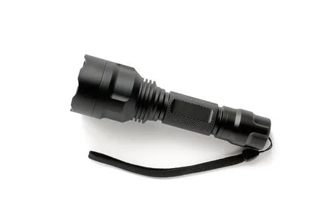 Black modern LED pocket flashlight made of aluminum, close-up Stock Photos