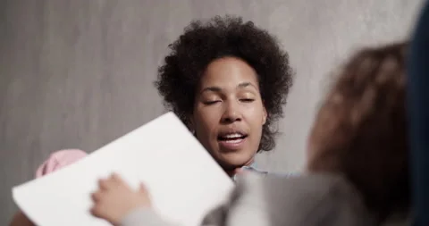 Black mom talking with creative child Stock Footage 200931076