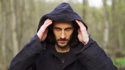 A black monk with different eyes in a cloak Видео 196607942
