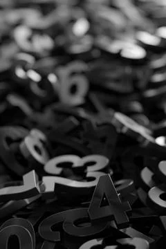 Black monochrome colored random digit metal numbers heap background, algebra, Stock Illustration