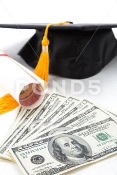 Black Mortarboard and dollar Stock Photos