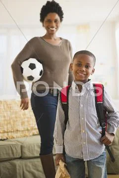 Black Mother And Son Getting Ready For The Day