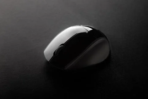 Black Mouse on Black Surface. Stock Photos
