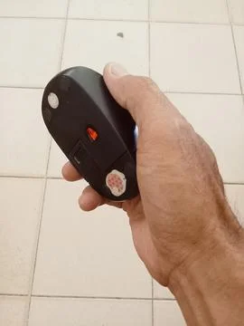 Black mouse in hand  Stock Photos