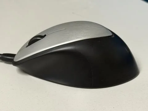 Black mouse on white background is a computer accessory 库存照片