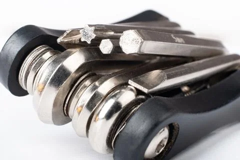 Black multitool with screwdriver and hex wrenches for bicycle closeup Stock Photos