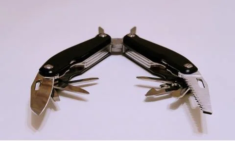 Black multitool on a white background Stock Photos