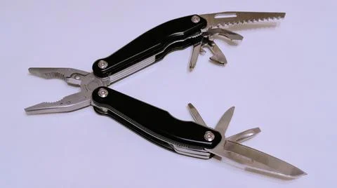 Black multitool on a white background side view Foto stock