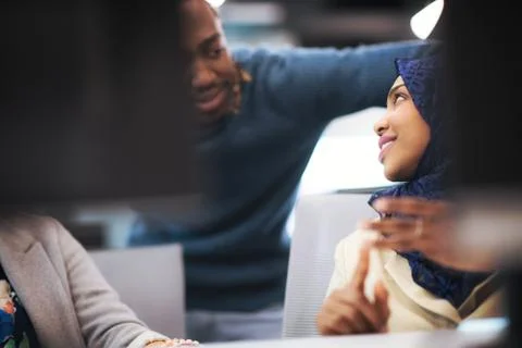 Black muslim female software developer at work Stock Photos