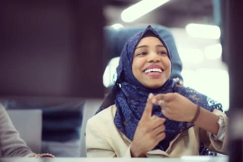 Black muslim female software developer at work Stock Photos