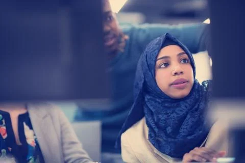 Black muslim female software developer at work Stock Photos