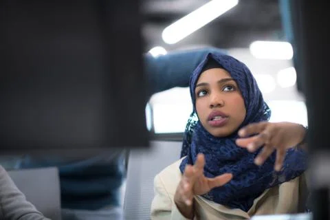 Black muslim female software developer at work Stock Photos