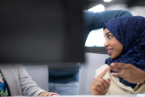 Black muslim female software developer at work Stock Photos
