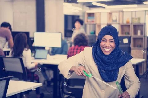 Black muslim software developer making soap bubble 스톡 사진