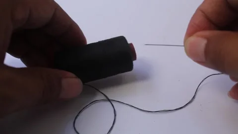 Black needle and thread Stock Footage 252570776