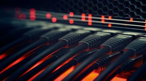 Black network cables plugged into a server rack with red status lights Stock-Footage 21381033